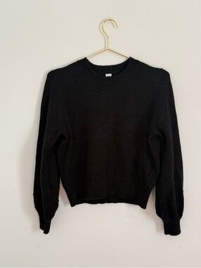 Black sweater with dotted accents
